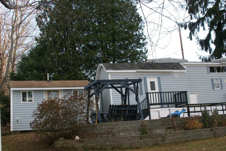 Small Bldg. to the left  has a full bathroom/laundry rm. and an outdoor shower