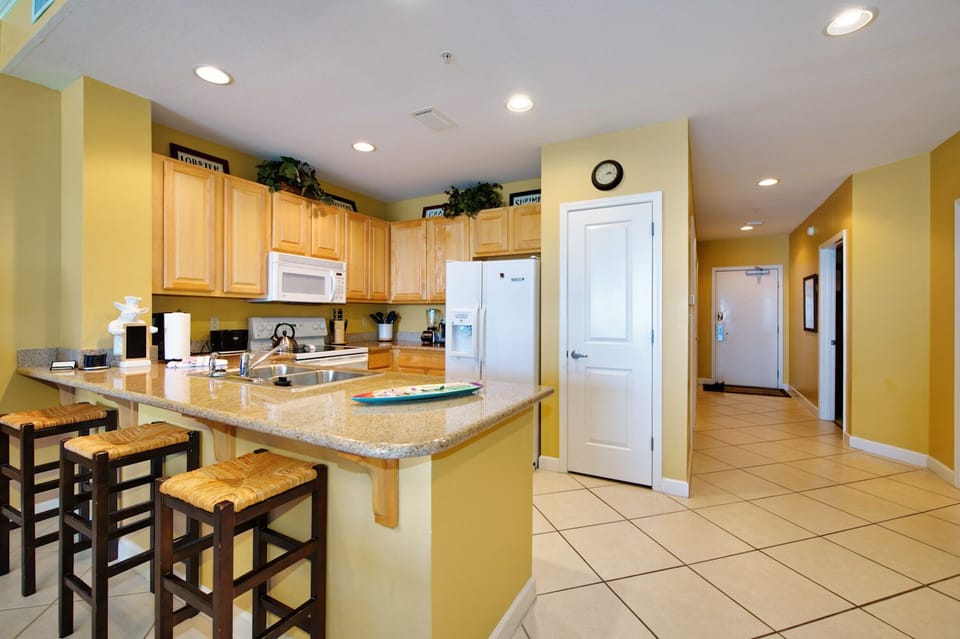 Kitchen with three bar stools for extra sitting space