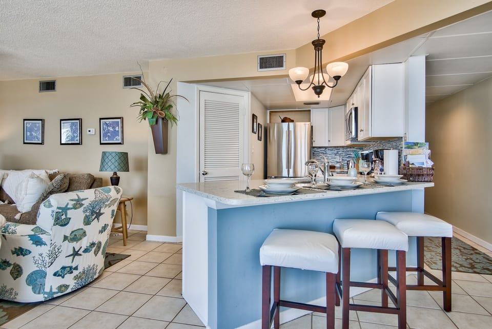 Modern appliances - refrigerator, microwave, stove/oven, and dishwasher.