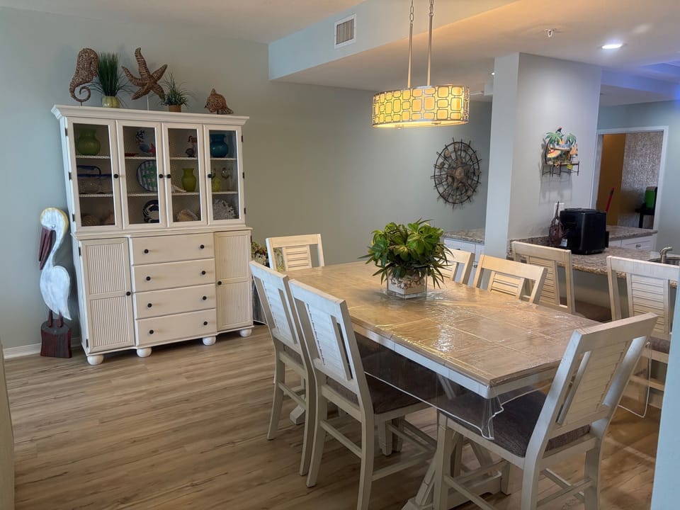Beautifully updated with new dining room set, bar stools, paint and flooring.