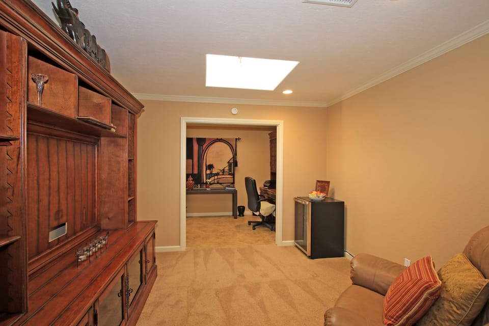 Den with Wine Cooler.  A twin roll-a-way bed can be set up in this room