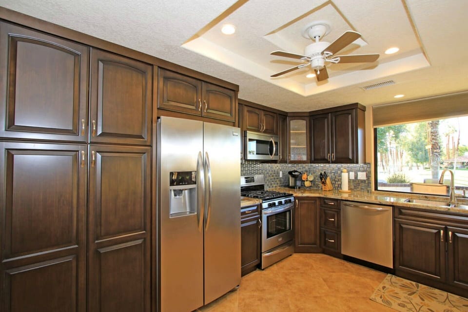 Upgraded Kitchen with granite counters and stainless steel appliances