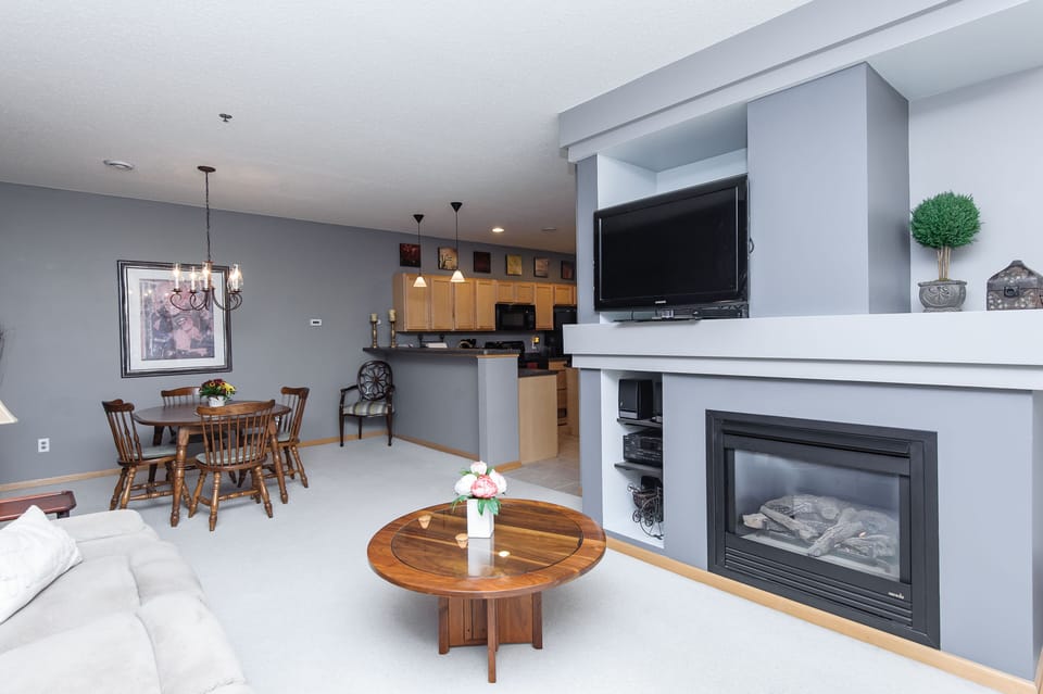 Modern, open floor plan.  Living room, dining space and kitchen.