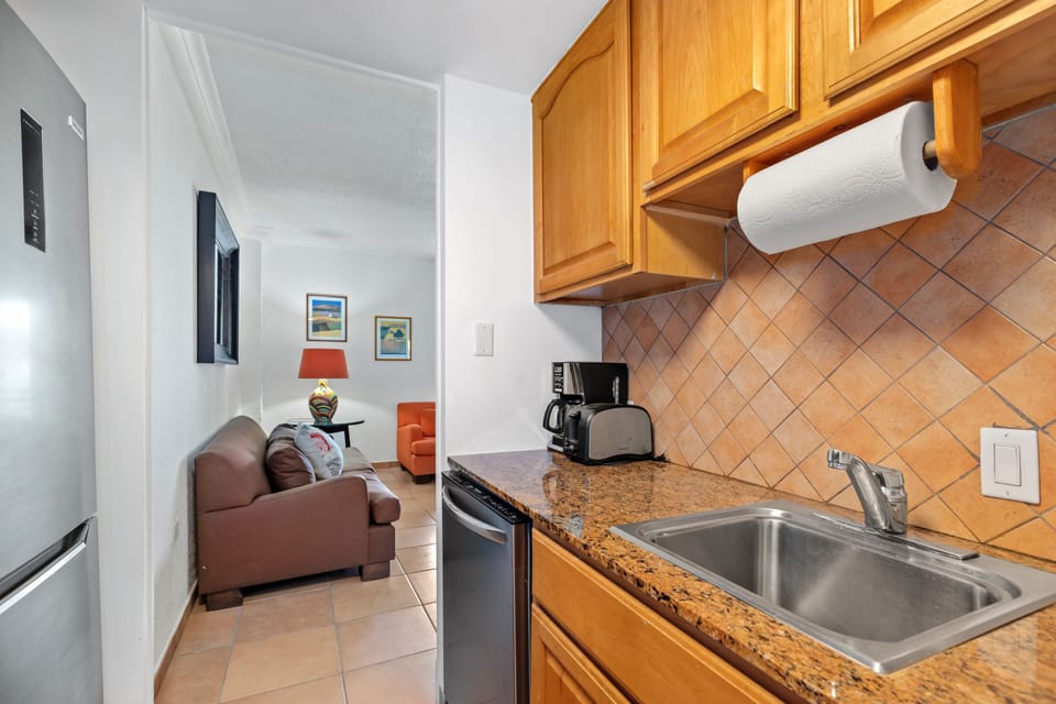 Kitchen connected to living room area 