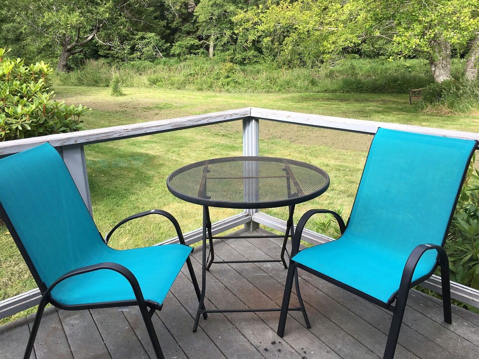 The deck - the Yachats River is located just behind it.