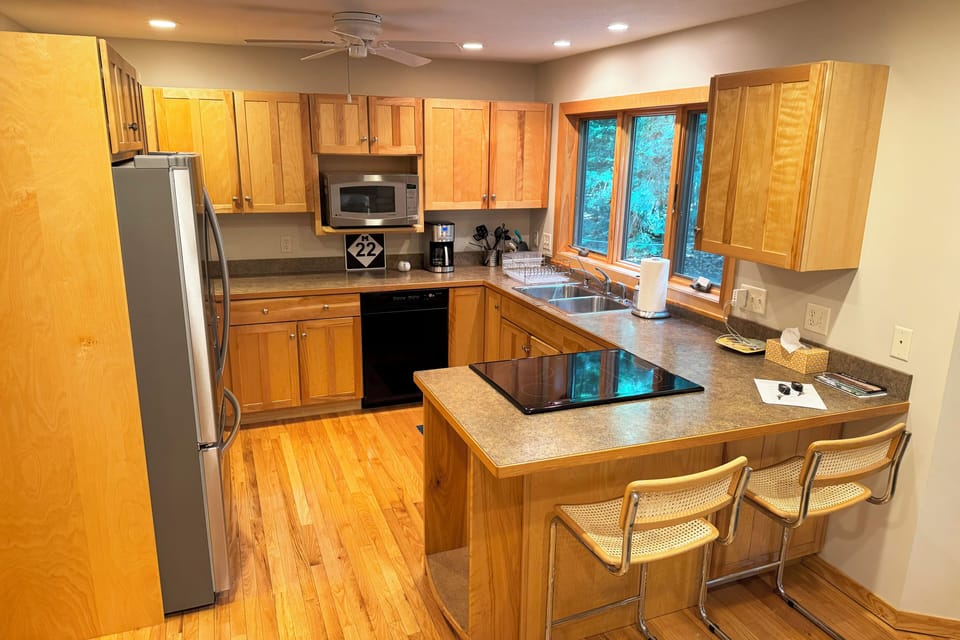 Kitchen with new refrigerator.
