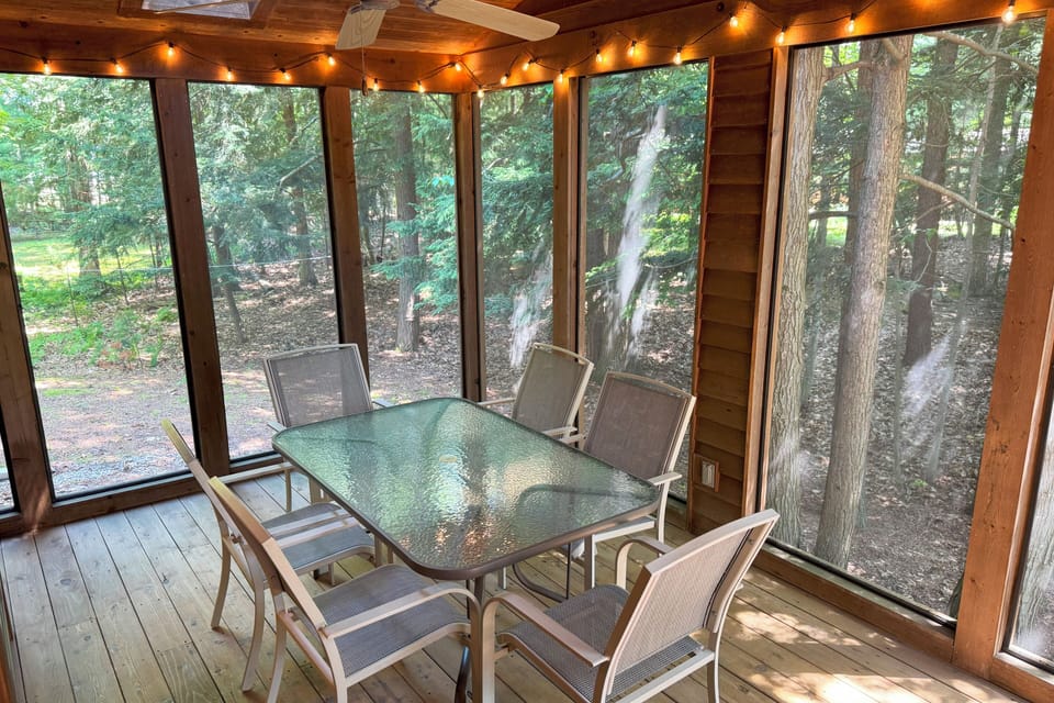Screened porch with additional dining space.