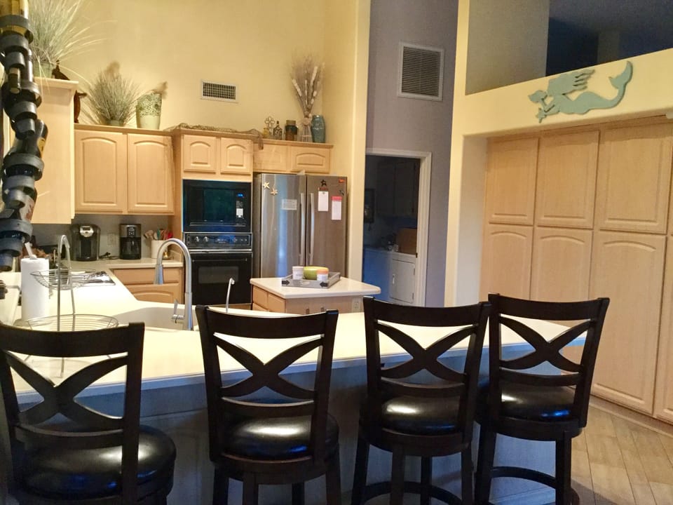  Kitchen with lots 
of cabinets.  Refrigerator with water/ice