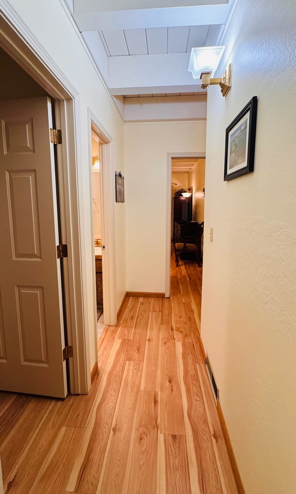 Hallway connecting bedrooms and shared bathroom
