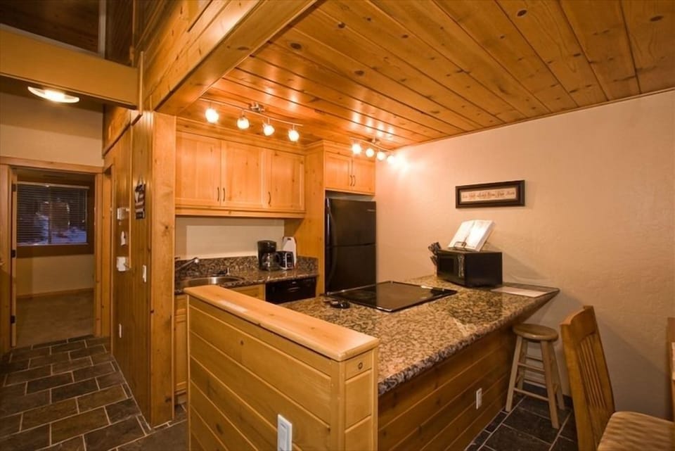 Equipped kitchen...stainless pots and pans, service for 4, coffee maker, micro