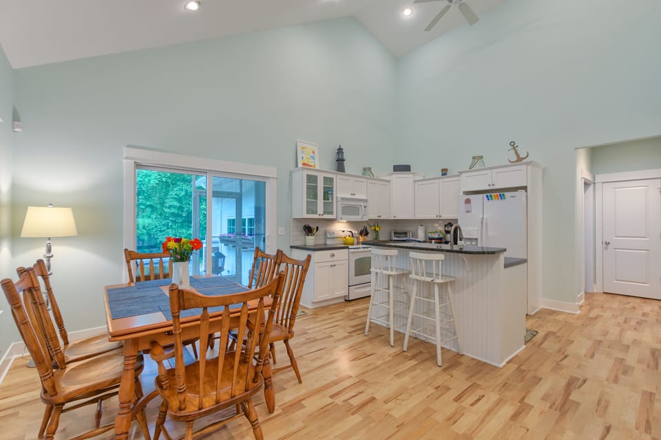 fully equipped kitchen with dishwasher, seating for 6-8 at the large table, two 