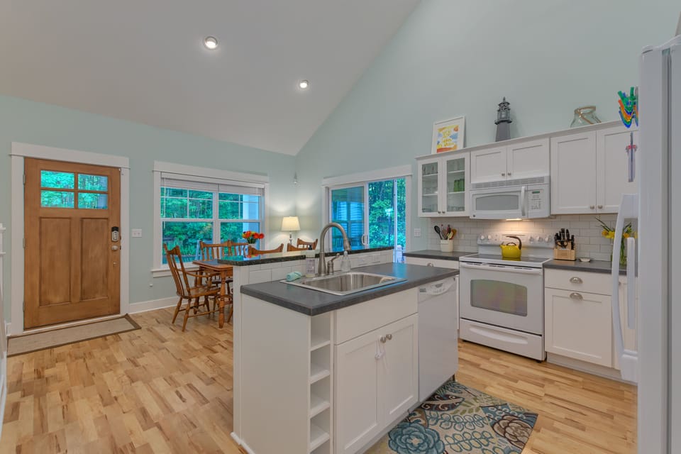 fully equipped kitchen with dishwasher, seating for 6-8 at the large table, two 