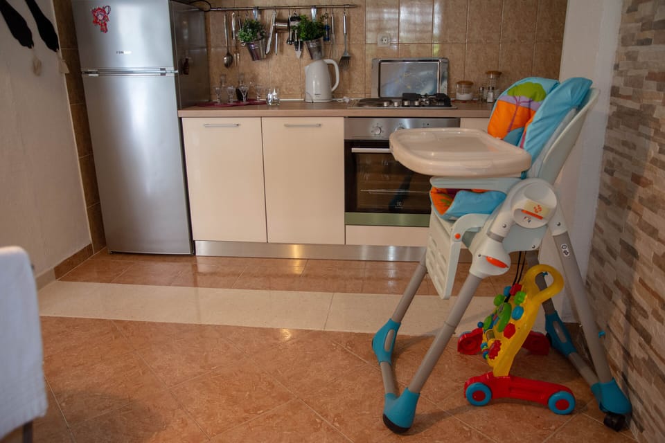 Kitchen and highchair for children.
