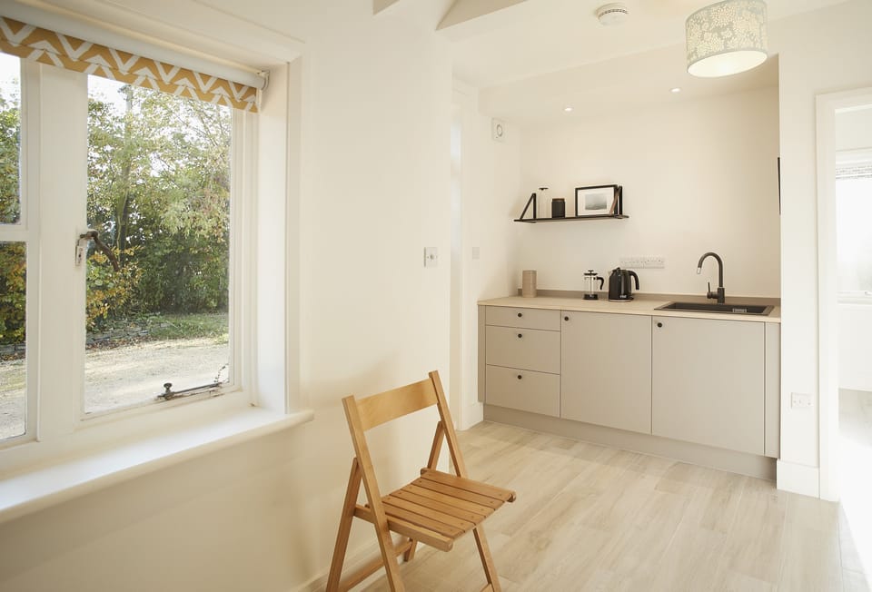 Ground floor: Self contained kitchenette linked to the bedroom and small living room