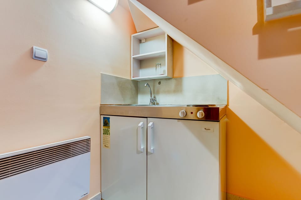 Kitchenette is Set in the Corner on the Lower Floor with Basic Amenities