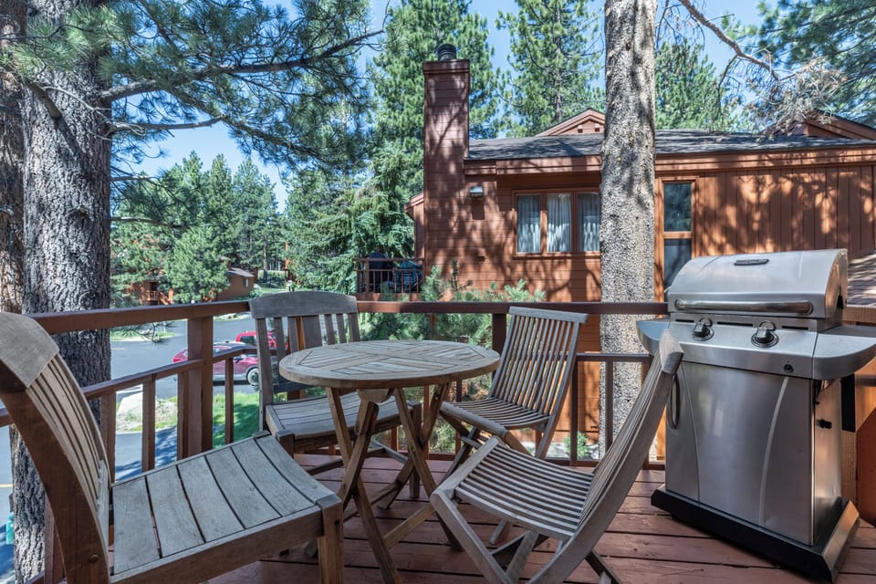 Outdoor deck with teak table, 4 teak chairs, and gas BBQ