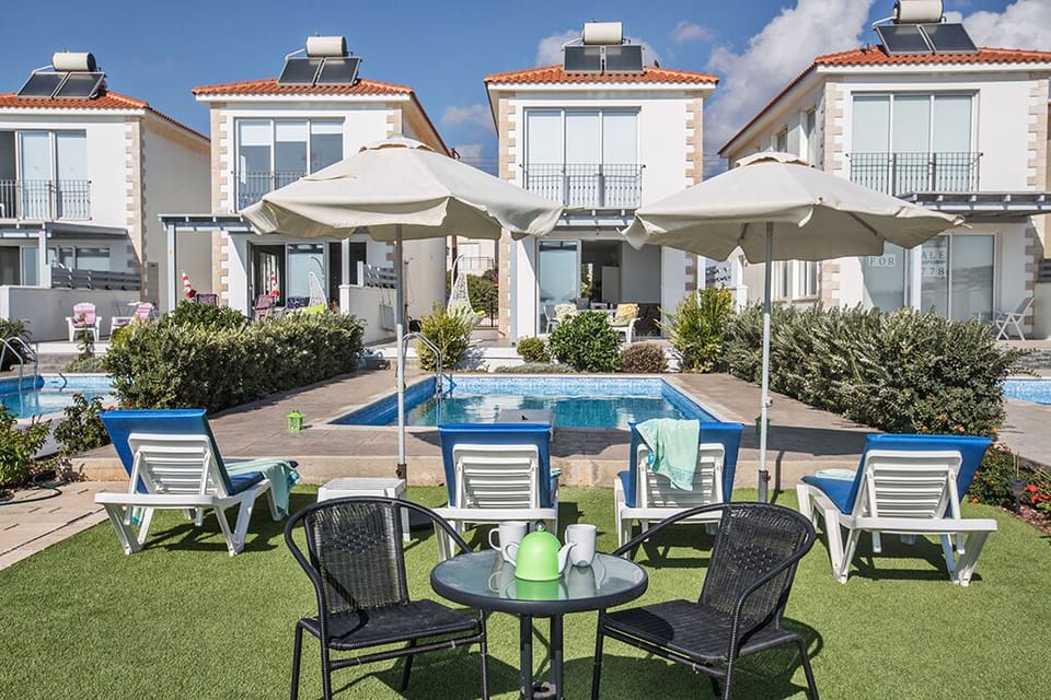Garden with barbecue, seating area, sun loungers and private pool