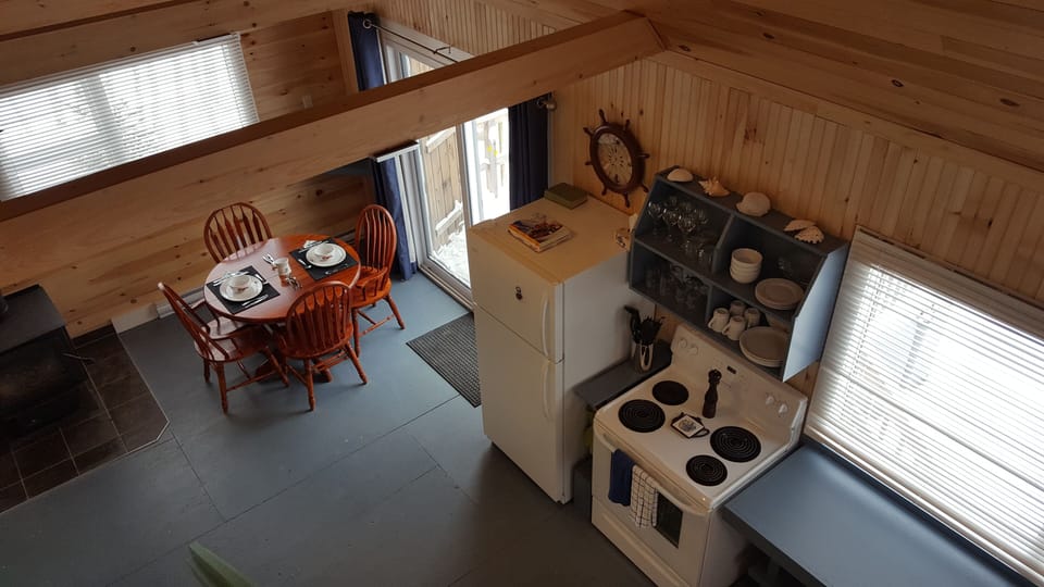 kitchen, dining area looking down from loft stairway