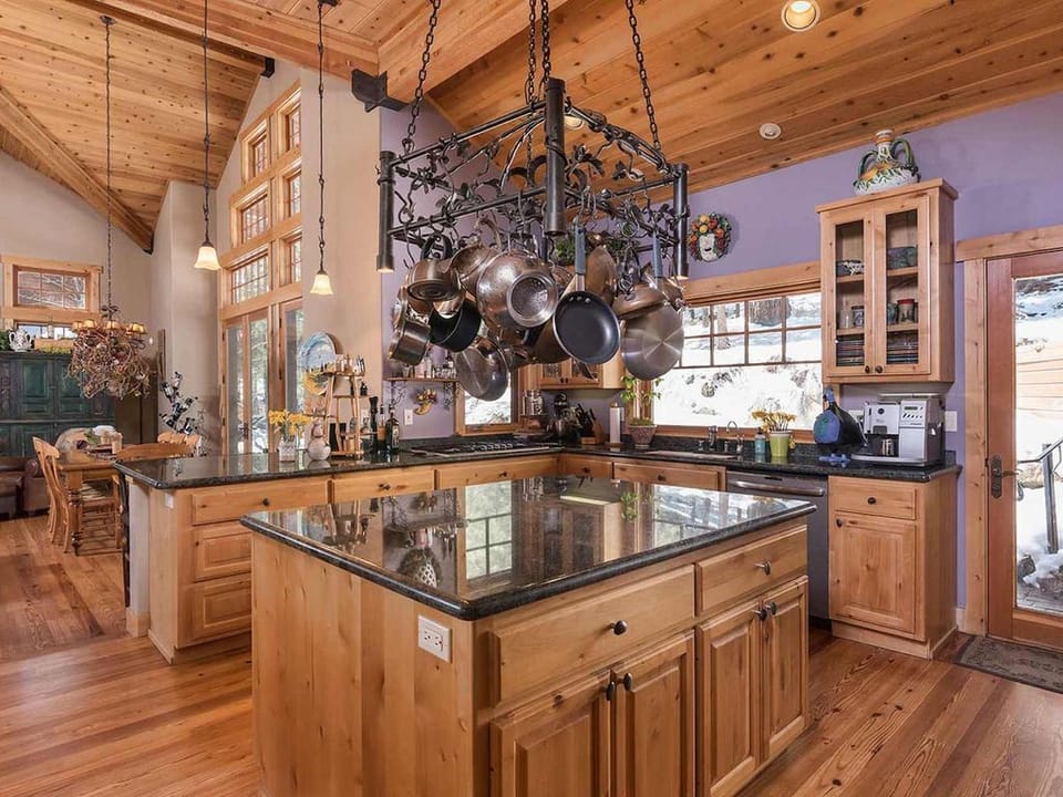 Cooktop and sink have beautiful private views of back courtyard 