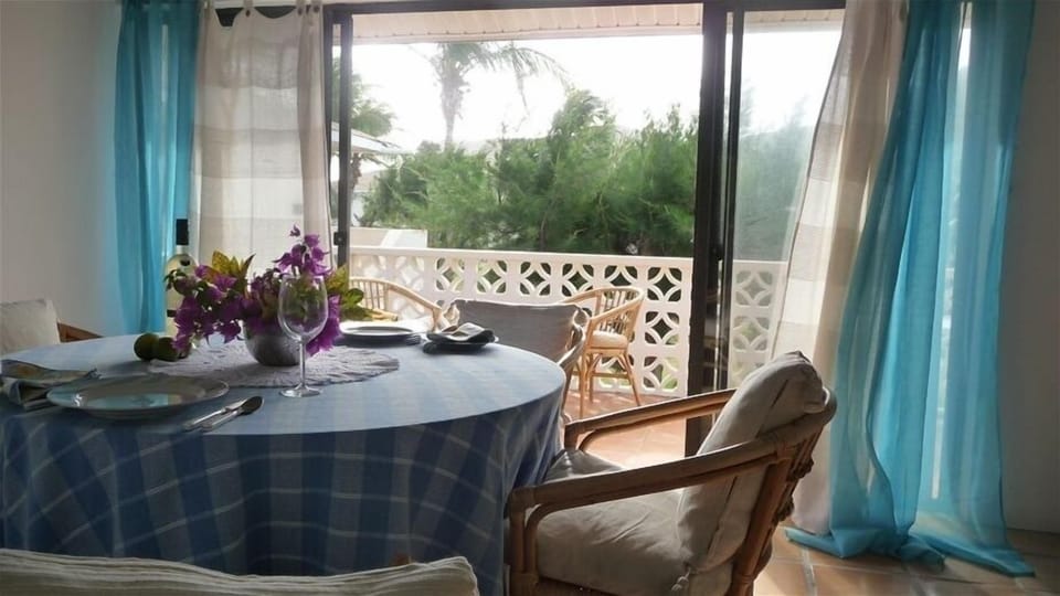Dining area with balcony beyond