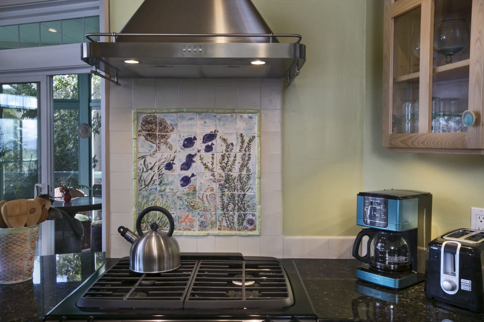 Tile backsplash with underwater scene which I made for the house..sculptures too