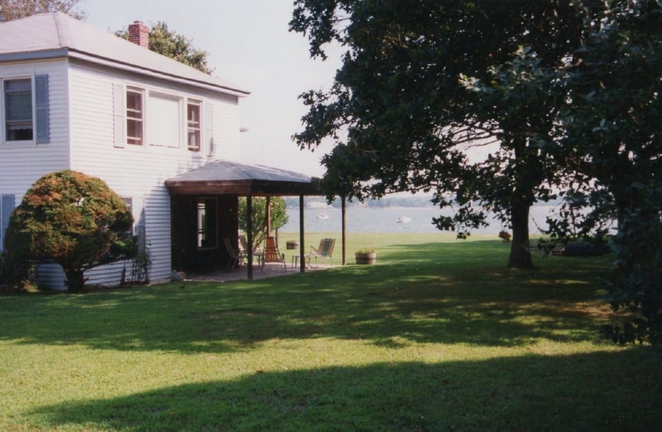 Street view of house toward the water.