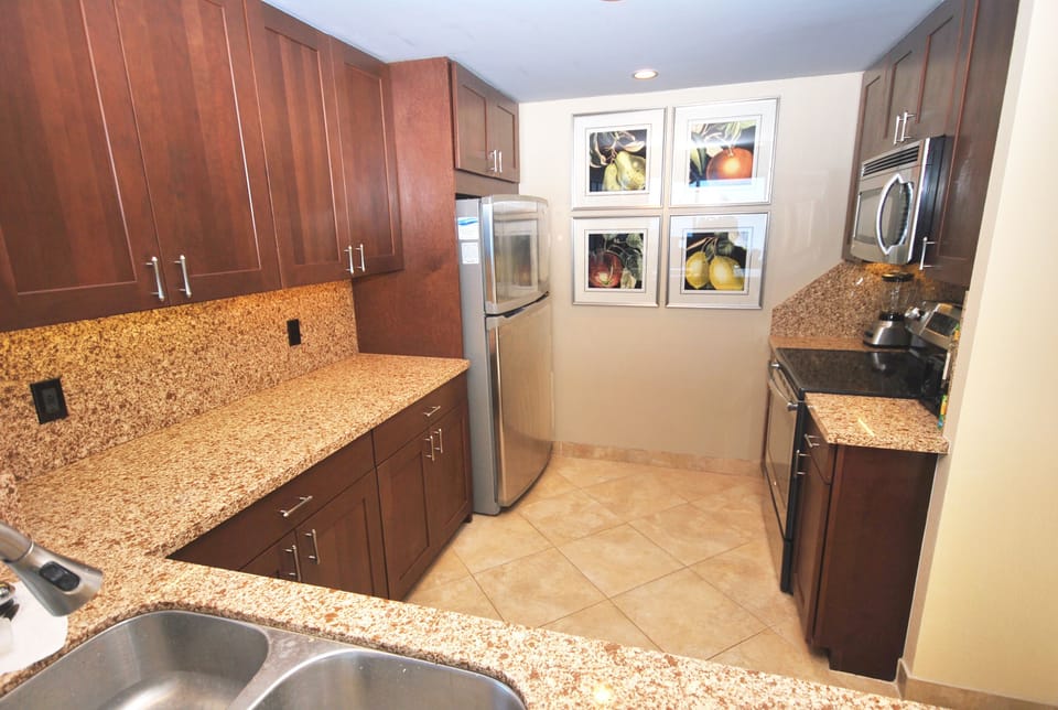 Well Appointed Kitchen with Stainless Appliances and Quartz countertops