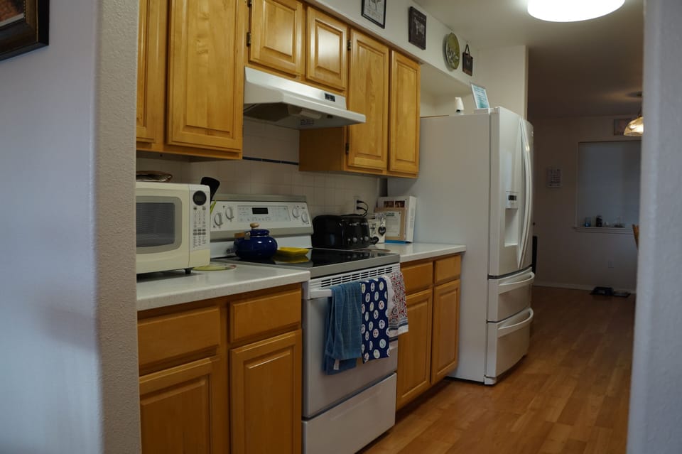 Fully stocked kitchen with all the pots, pans and spices you might need.