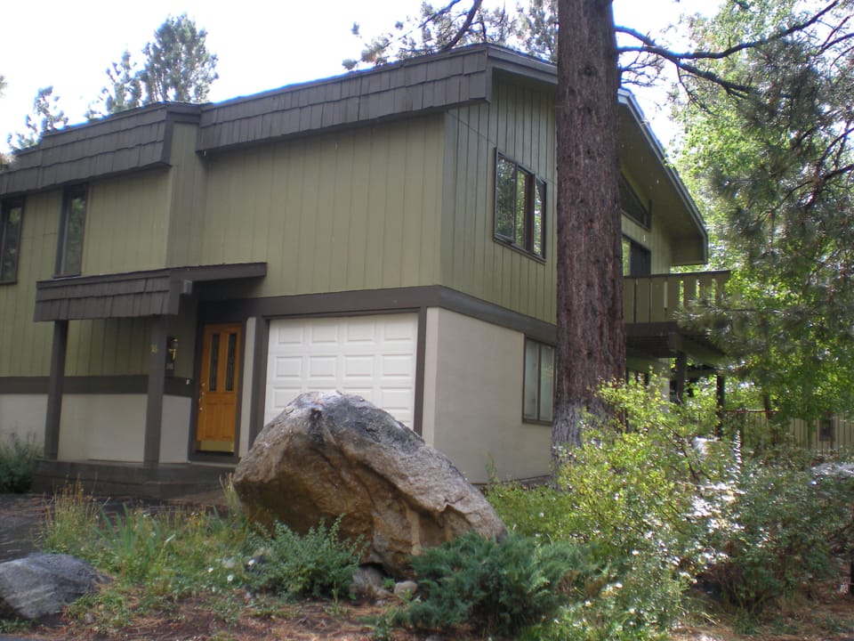 Front door and garage parking for a two story townhome