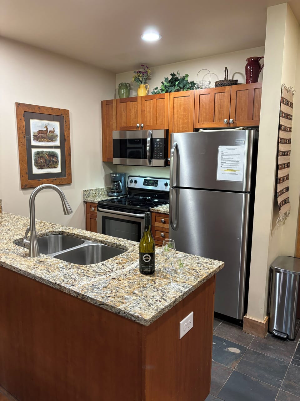 Nice long granite counter top with updated lighting, updated kitchen hardware 