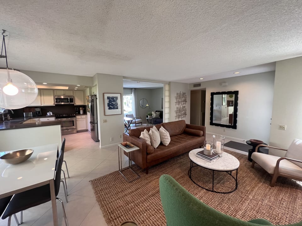 Living, dining, kitchen, plus den/office, make for a wonderful gathering place.