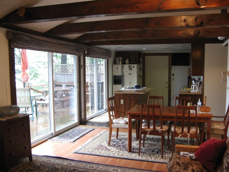 Dining area looking into the kitchen, with the front door in the background.