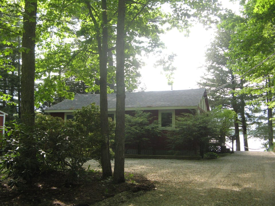 Road side of the cottage.  Campfire pit down the driveway on the right.  Smores?