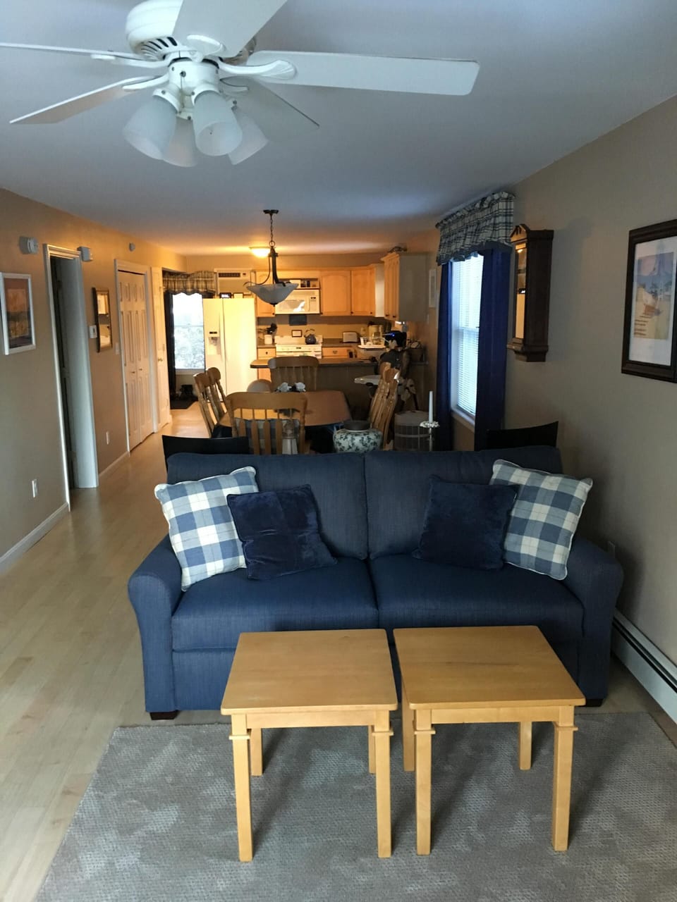 View of TV sitting area and kitchen in the background