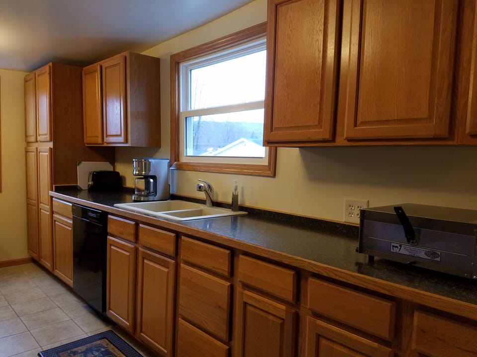 Kitchen with lots of counter space, coffee maker, pizza oven and toaster
