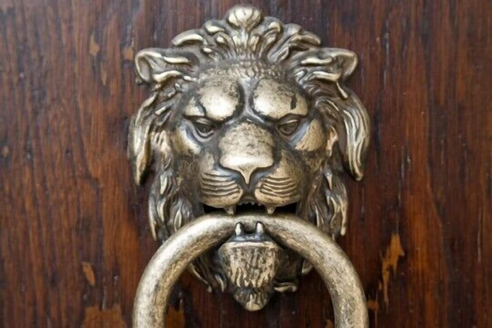 The handle of the antique front door.