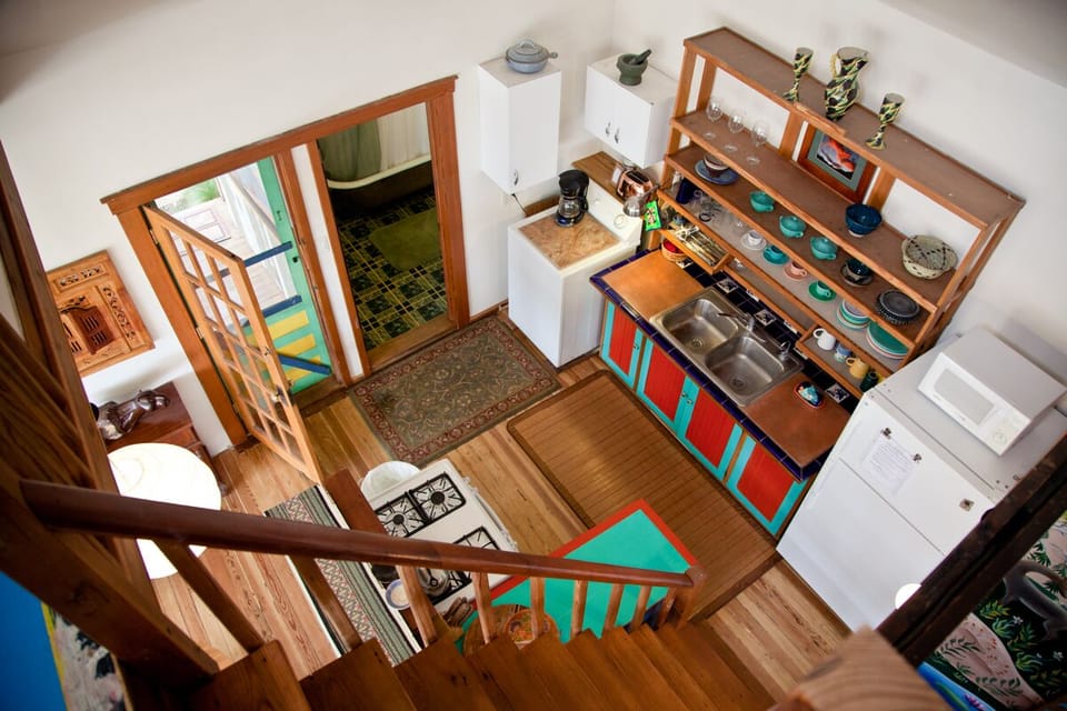  View of the kitchen from loft which has an additional queensize bed.  