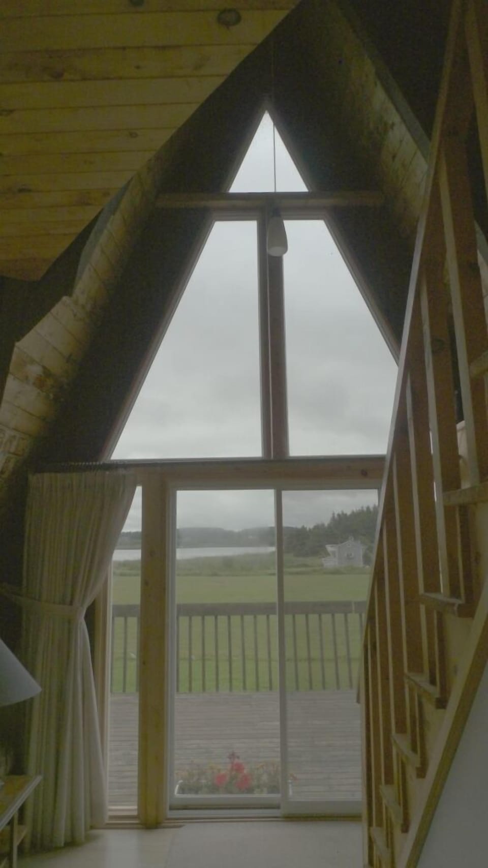 View of deck and pond from great room