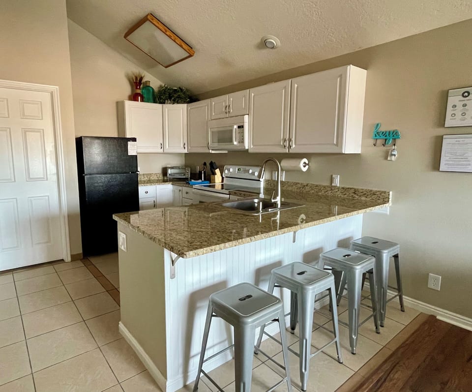 Updated kitchen. Range & oven, microwave, dishwasher, refrigerator. 
