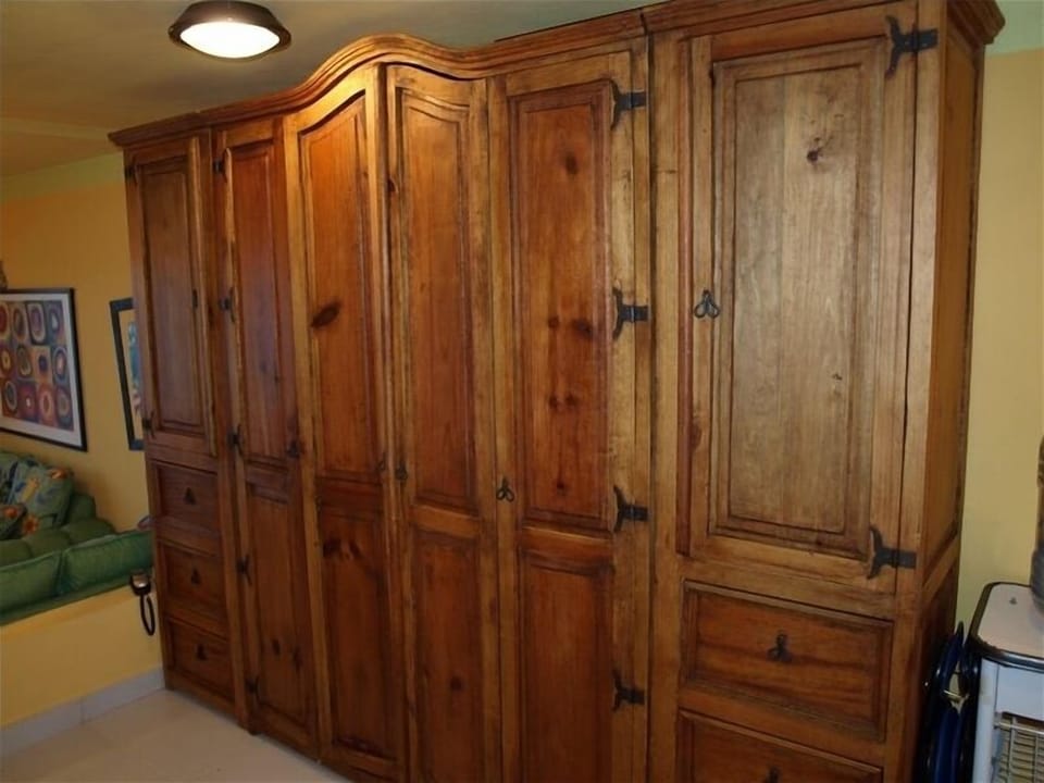 The unique Murphy queen bed with his and hers wardrobes and drawers