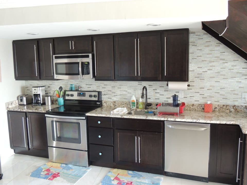 New Stainless throughout.  Granite counters.  Ceramic finish cookware.