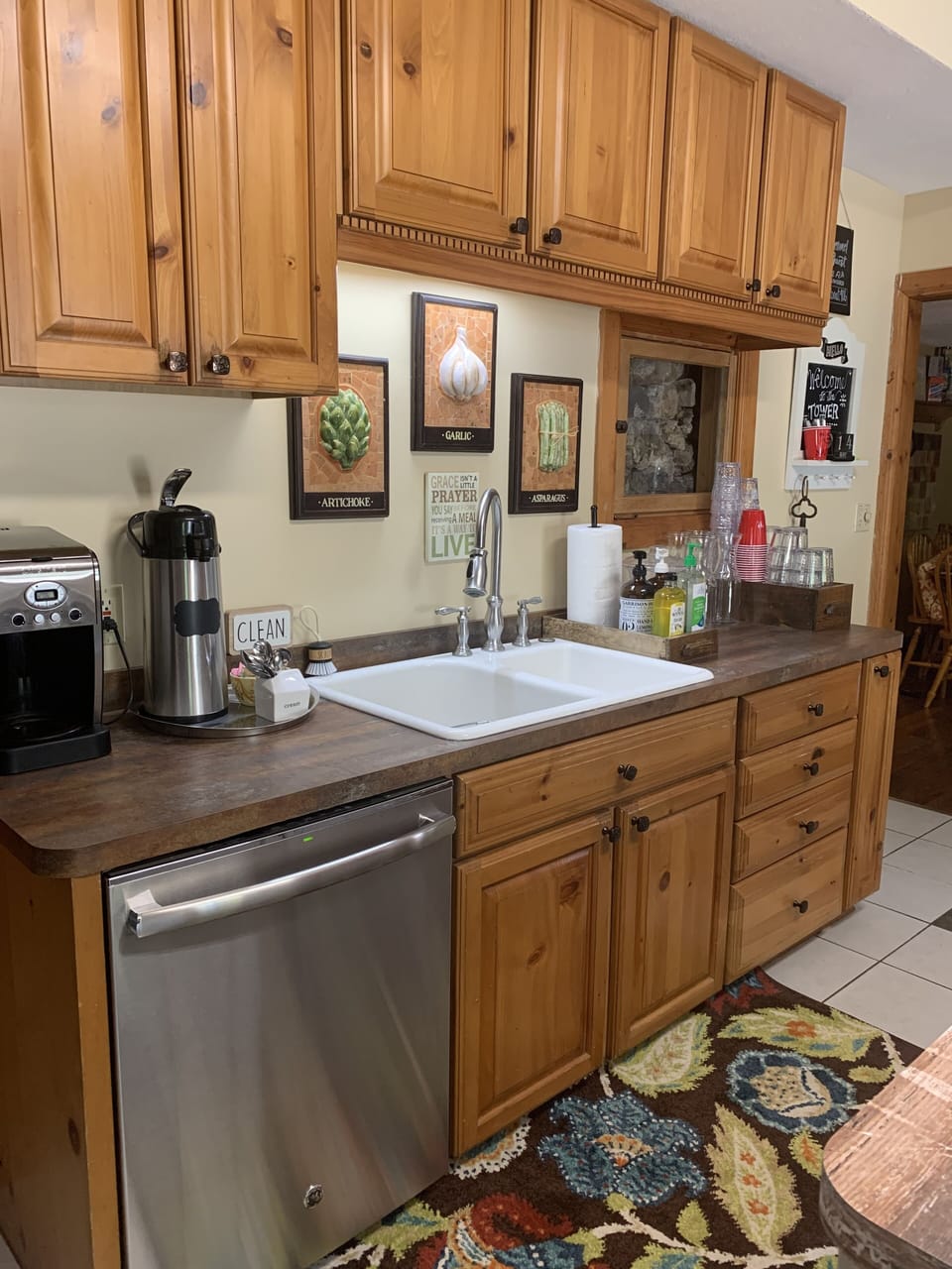 Cabinets are stocked with dishes, utensils, cooking equipment, provisions pantry