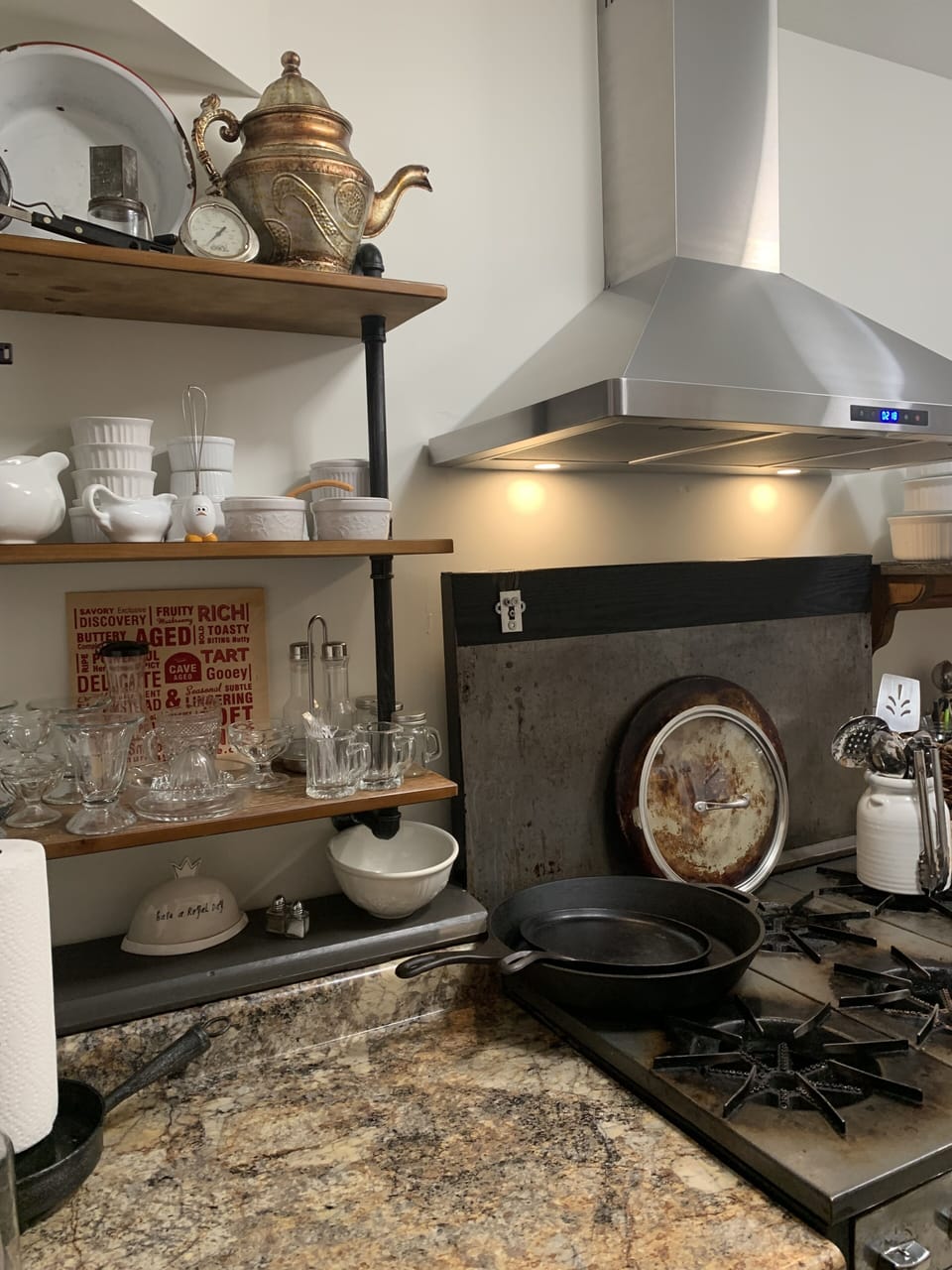 Chef's Kitchen w/ open shelves.  Stocked w/ cooking equipment, stocked pantry.