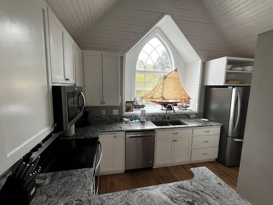 Kitchen to dining to living room for open floor plan. 