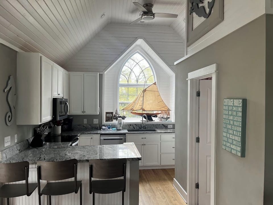 Full kitchen with full fridge, stove, dish washer, coffee maker and microwave. 