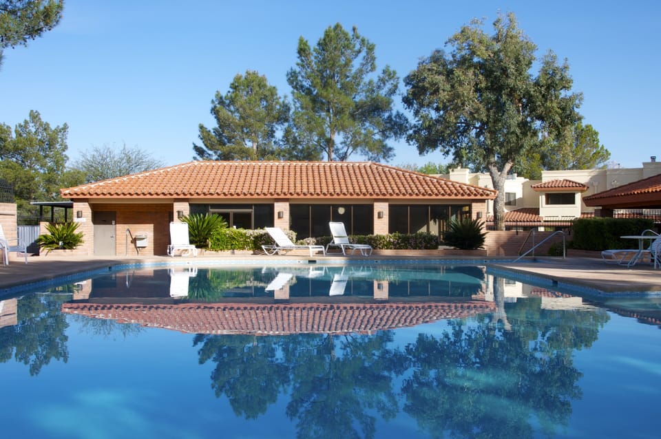 Communal YEAR-ROUND HEATED pool with clubhouse and bathrooms.