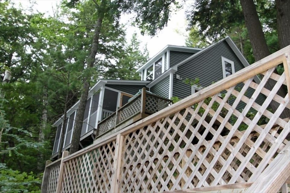 Cottage from the waterfront.  Note screened-in porch.