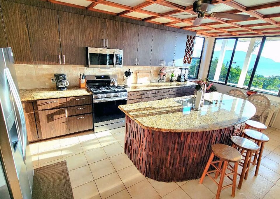 Large island makes gathering in the kitchen so comfortable.