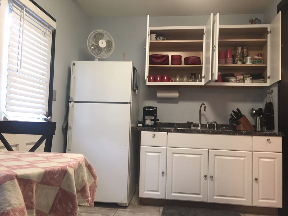 Fully stocked kitchenette, dishware, full-size refrigerator & microwave.  