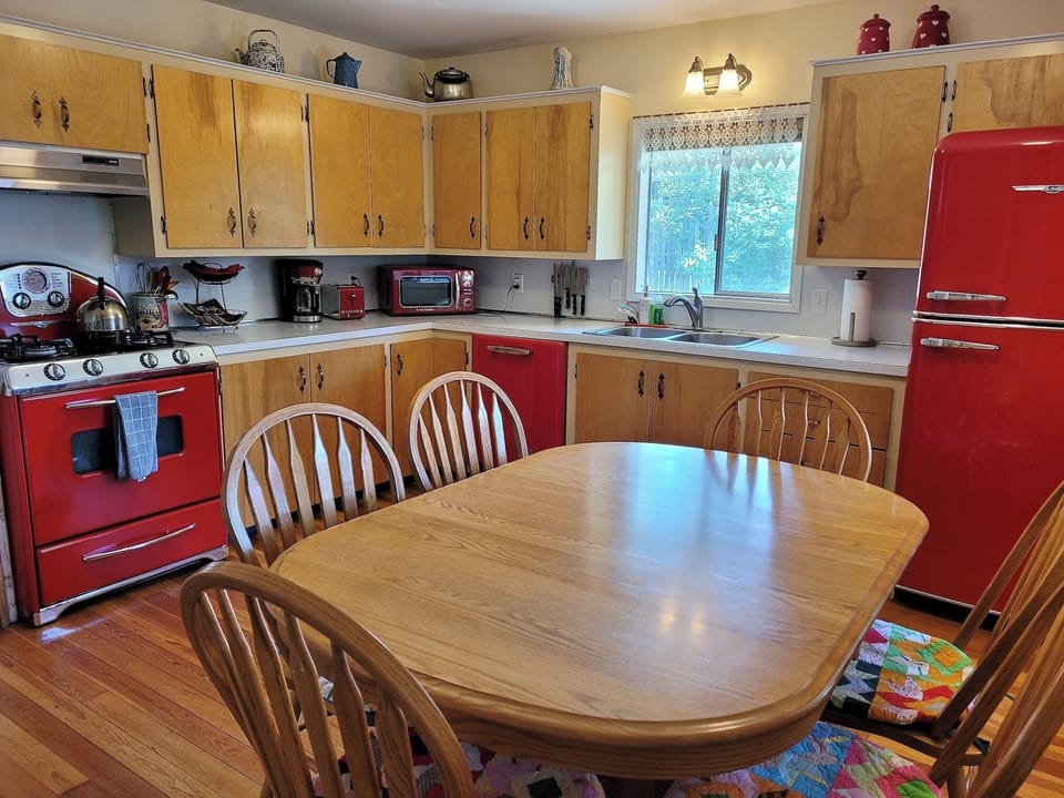 Retro red appliances and  eat in 
kitchen